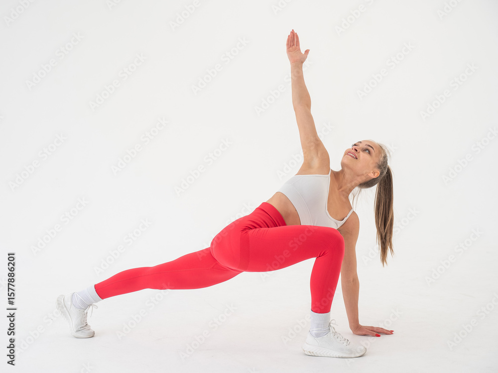 Fototapeta premium Caucasian woman doing sports exercises on white background. 