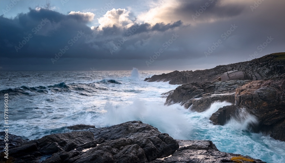 dramatic seascape crashing against rocky coastline on cloudy day dramatic seascape crashing against rocky coastline on cloudy day