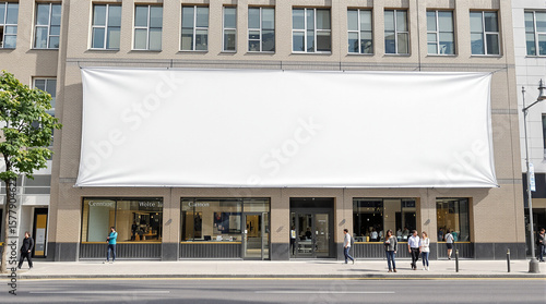 Large blank banner mockup hanging on urban building exterior in city  