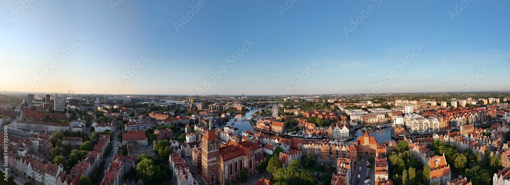 Obraz premium Aerial photo taken by drone over the historic tourist center of Gdansk, the city hall and the cathedral on a summer day, Poland, Europe