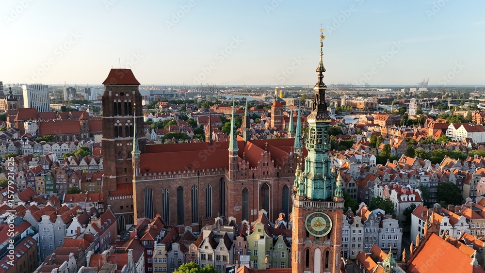 Obraz premium Aerial photo taken by drone over the historic tourist center of Gdansk, the city hall and the cathedral on a summer day, Poland, Europe