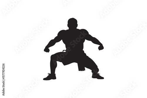 Silhouette of a muscular man in a fighting stance