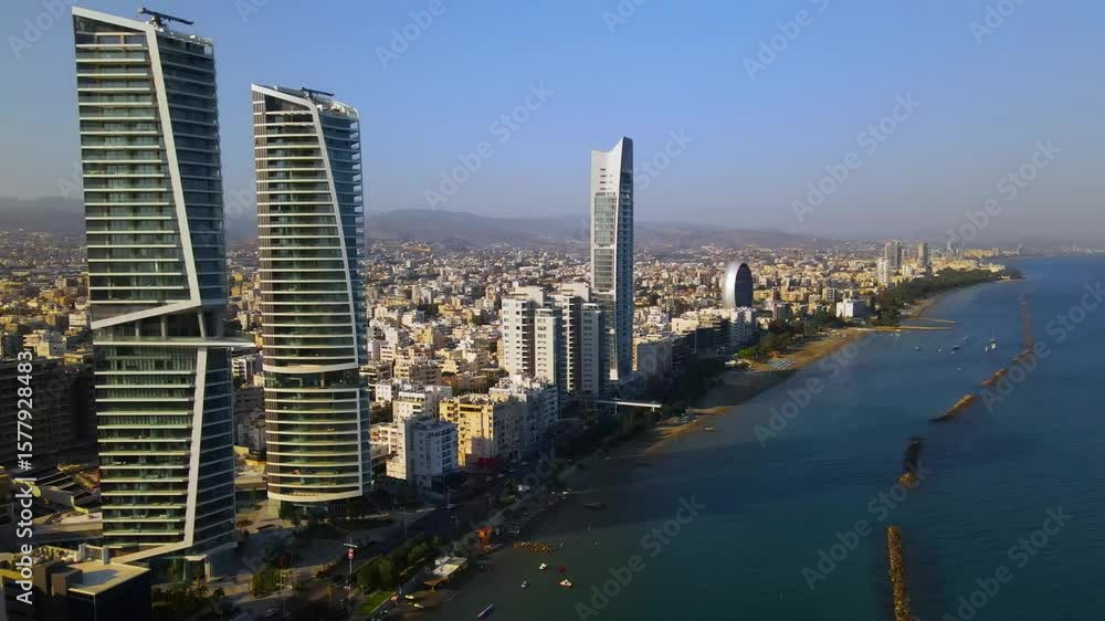 View from above on Limassol buildings, evening Cyprus
High-rise towers of Cyprus. Summer sunset and Mediterranean sea with city traffic in the background View from above on Limassol buildings, evening Cyprus
High-rise towers of Cyprus. Summer sunset and Mediterranean sea with city traffic in the background