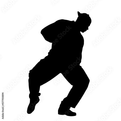 Silhouette of a man dancing energetically in casual clothing  