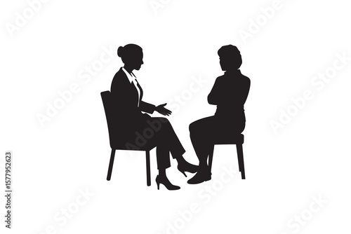 Silhouette of two women in a meeting one gesturing while the other listens attentively with arms crossed isolated on a white background