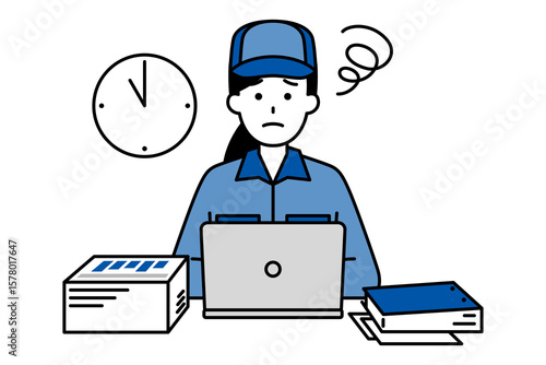 デスクワークの残業に困っているつなぎ作業服の女性