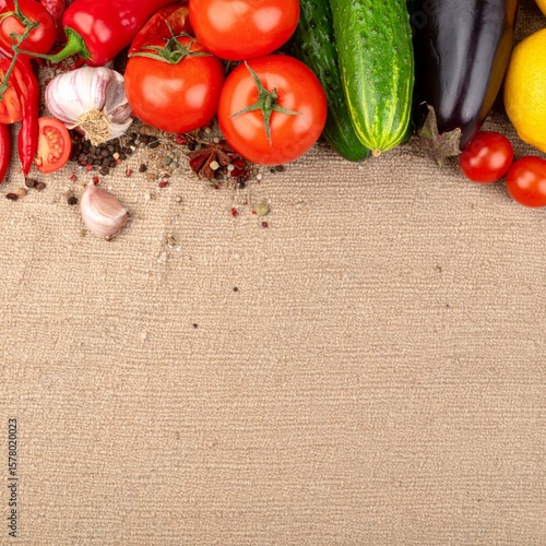 Colorful Vegetables and Spices Still Life Composition on Burlap Background