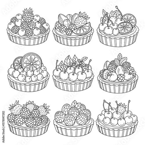 Set of fruit tarts with berries and citrus slices on dark background