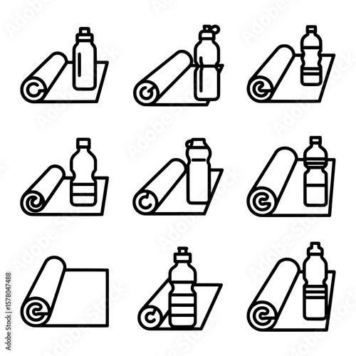 set of water bottles and towels on gym mat