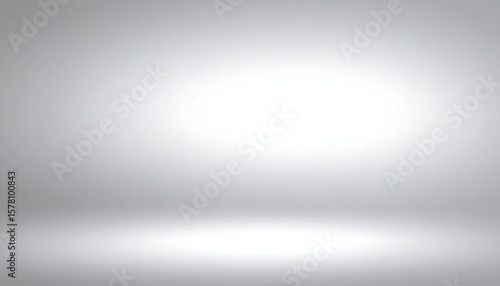 Empty, neutral gray studio backdrop, soft gradient