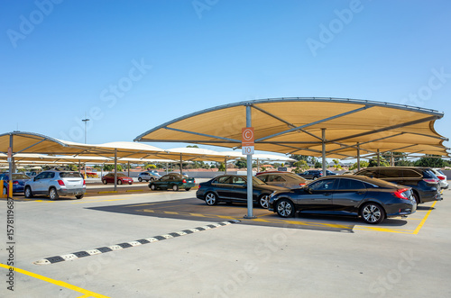 фотографія Modern open-air parking lot in Australia featuring tensile fabric shade structures over parked vehicles