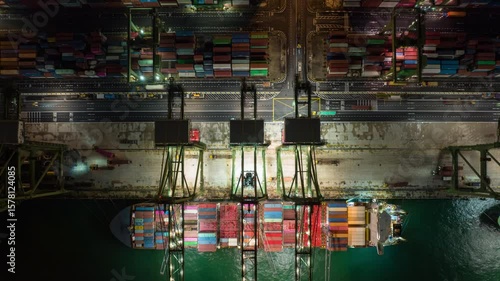 Wallpaper Mural night time illuminated singapore city world famous container port cargo ship loading bay traffic aerial panorama 4k timelapse Torontodigital.ca