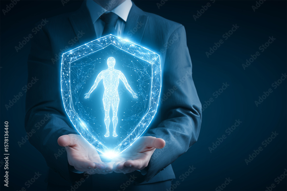 Fototapeta premium A businessman holding a glowing shield