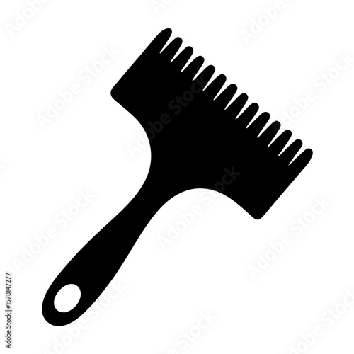 Black silhouette of a cake icing smoother with a handle and hole