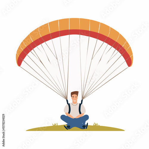Smiling Paraglider Sitting on Grass Under Colorful Parachute, Enjoying the Adventure