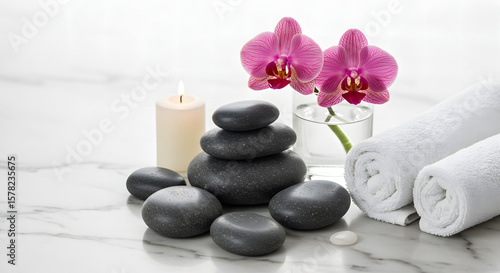 Spa and Wellness Still Life with Hot Stones, Orchid Flowers, and Towels







