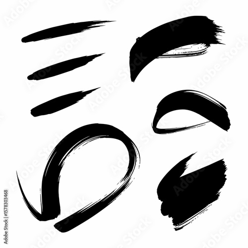Artistic black brushstrokes on a white background, perfect for design elements.