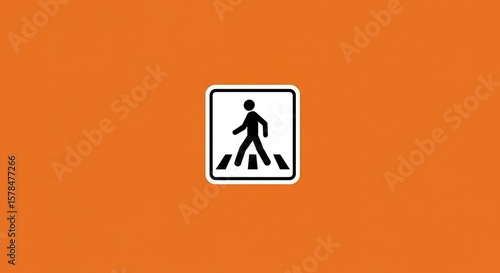 Pedestrian crossing sign on orange background