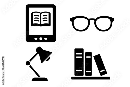 Digital reading: e-book device, eyeglasses, desk lamp, books on shelf