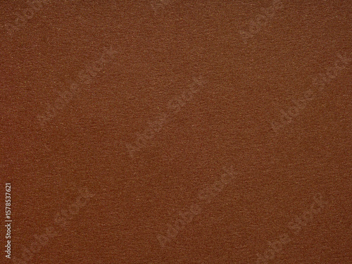 Foto A rich terra cotta canvas, the paper's texture beckons with earthy warmth and an