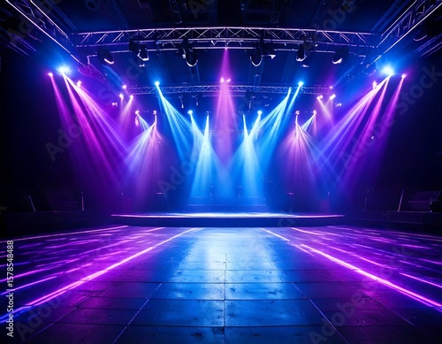 A stage illuminated with vibrant purple and blue lights, creating a dynamic and energetic at.jpg
