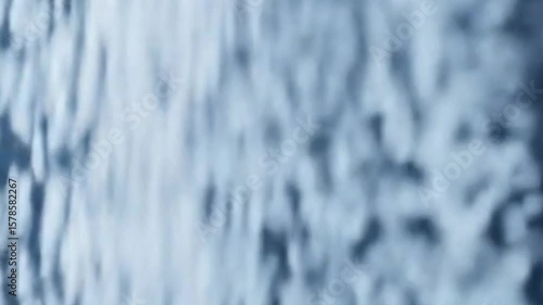 Abstract background of flowing white particles against a dark blue backdrop