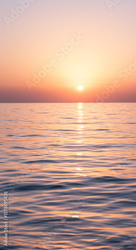 Golden hour on the sea A serene sunset reflected on the water's surface, creating a peaceful and dreamy seascape
