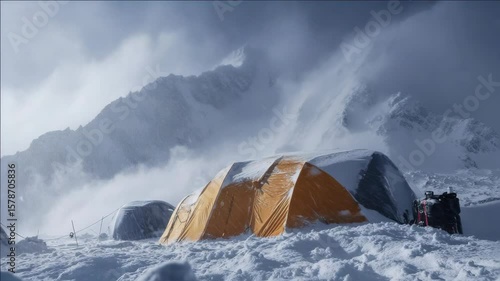 Snowy mountain tent pitched during a storm.