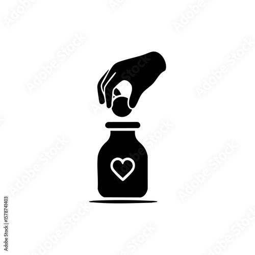 A hand placing a coin into a jar marked with a heart, symbolizing hope, generosity, and charitable giving.
