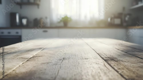 Sunlit Rustic Wooden Kitchen Counter with Blurred Light and Plant Decor
