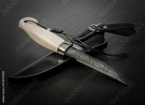 Souvenir collectible knife  with sheaths. Bone handle, on black. 