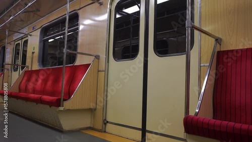 A video showcasing close-up views of worn, vintage seats from an old Soviet-era metro station, highlighting the passage of time and historical context.