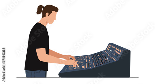 Man operating a complex audio mixing console with sliders and buttons wearing a black t-shirt.
