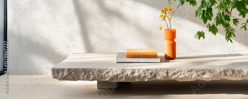 Stone tabletop still life with books and flowers