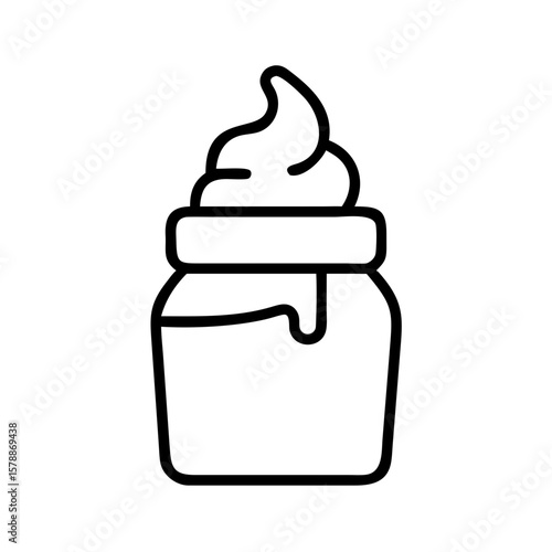 Icing in glass jar with swirl pattern on top  