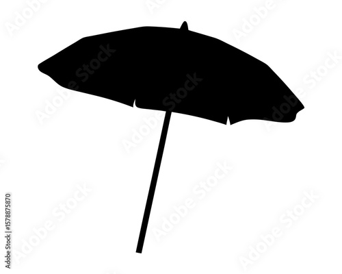 Striking silhouette of a beach umbrella providing shade in summertime vacation