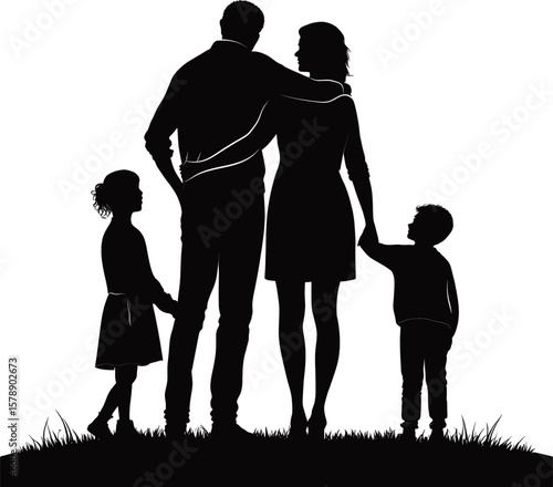A family of four is standing on a grassy hill, with the man and woman holding hands and the children looking up at them. Concept of warmth and togetherness