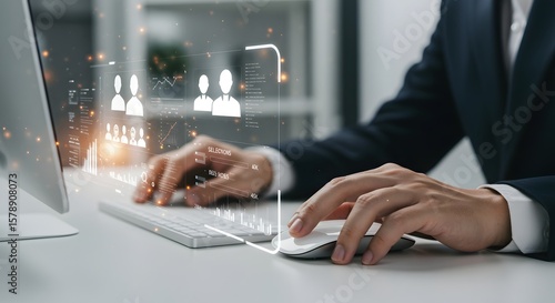 Business Professional Using Computer with Futuristic Interface for Data Analysis and Recruitment