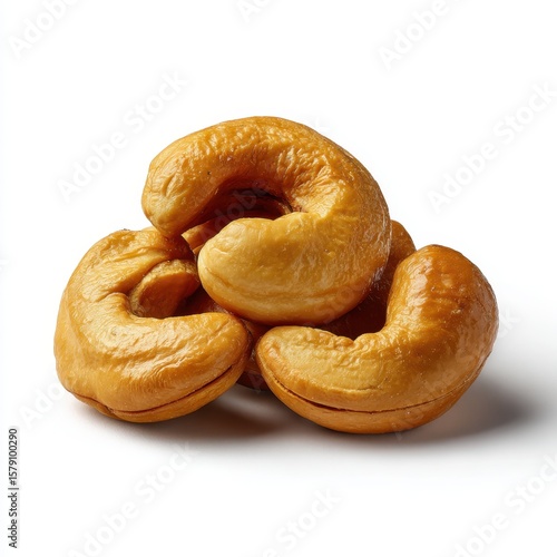 Pile of golden roasted cashew nuts isolated on white background