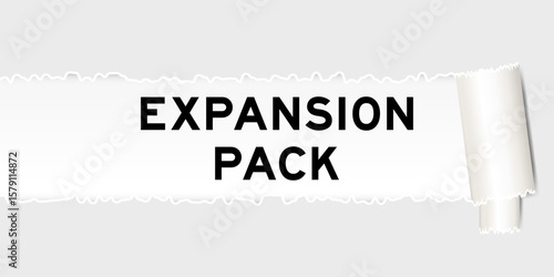 Ripped gray paper background that have word expansion pack under torn part