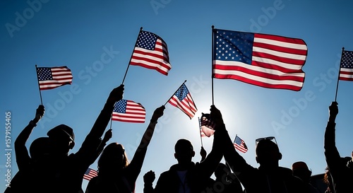 Group of People Waving American Flags in Back Lit