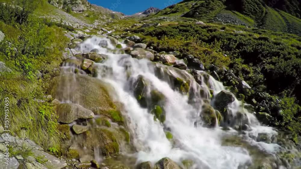 Mountain stream cascading over rocks Mountain stream cascading over rocks