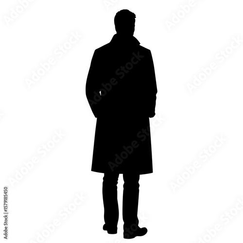 Silhouette of man standing with hands in pockets wearing coat  