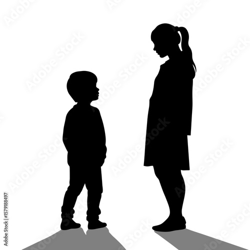 Silhouettes of boy and girl standing and looking at each other  