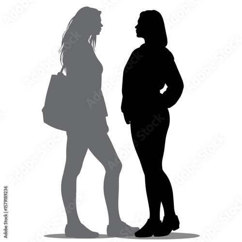 Silhouettes of two women standing and talking in profile view  