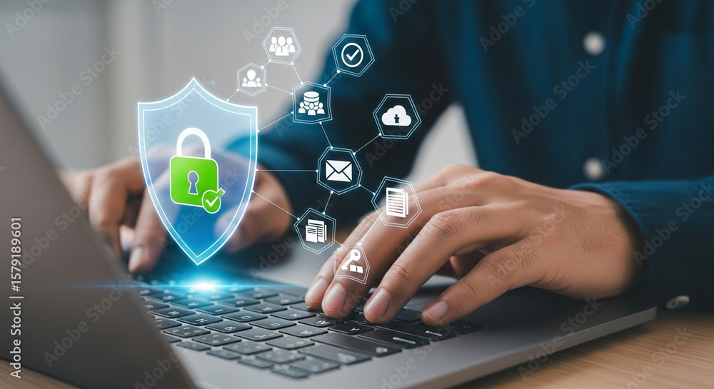 Naklejka premium A businessman is typing on a laptop with a digital shield and padlock representing cybersecurity and data protection