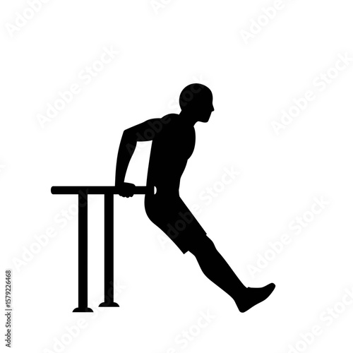 Silhouette Strength: A strong silhouette of a man executing parallel bar dips, showcasing the dedication to physical fitness and athletic pursuit.