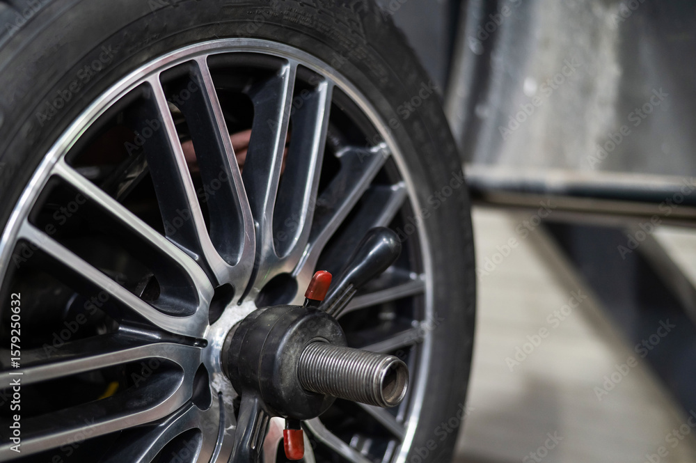 Fototapeta premium Close up of car wheel and rim assembly.