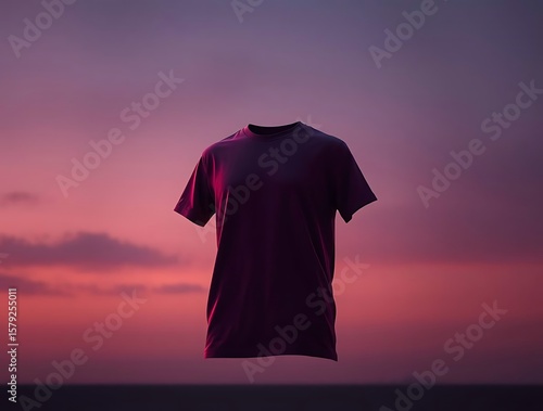 Floating t-shirt against a vibrant sunset sky evoking dreaminess