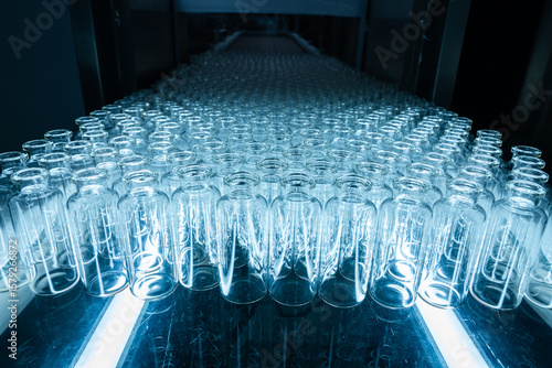 empty injection vials pharma grade injection glass vials to be filled with medical chemical drugs in an injection manufacturing line inside a healthcare pharma industry factory	
